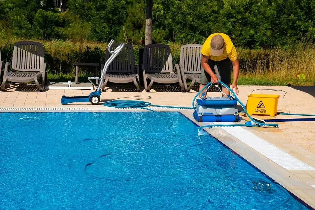 Professional Pool Maintenance technician servicing a Meridan Plains backyard pool